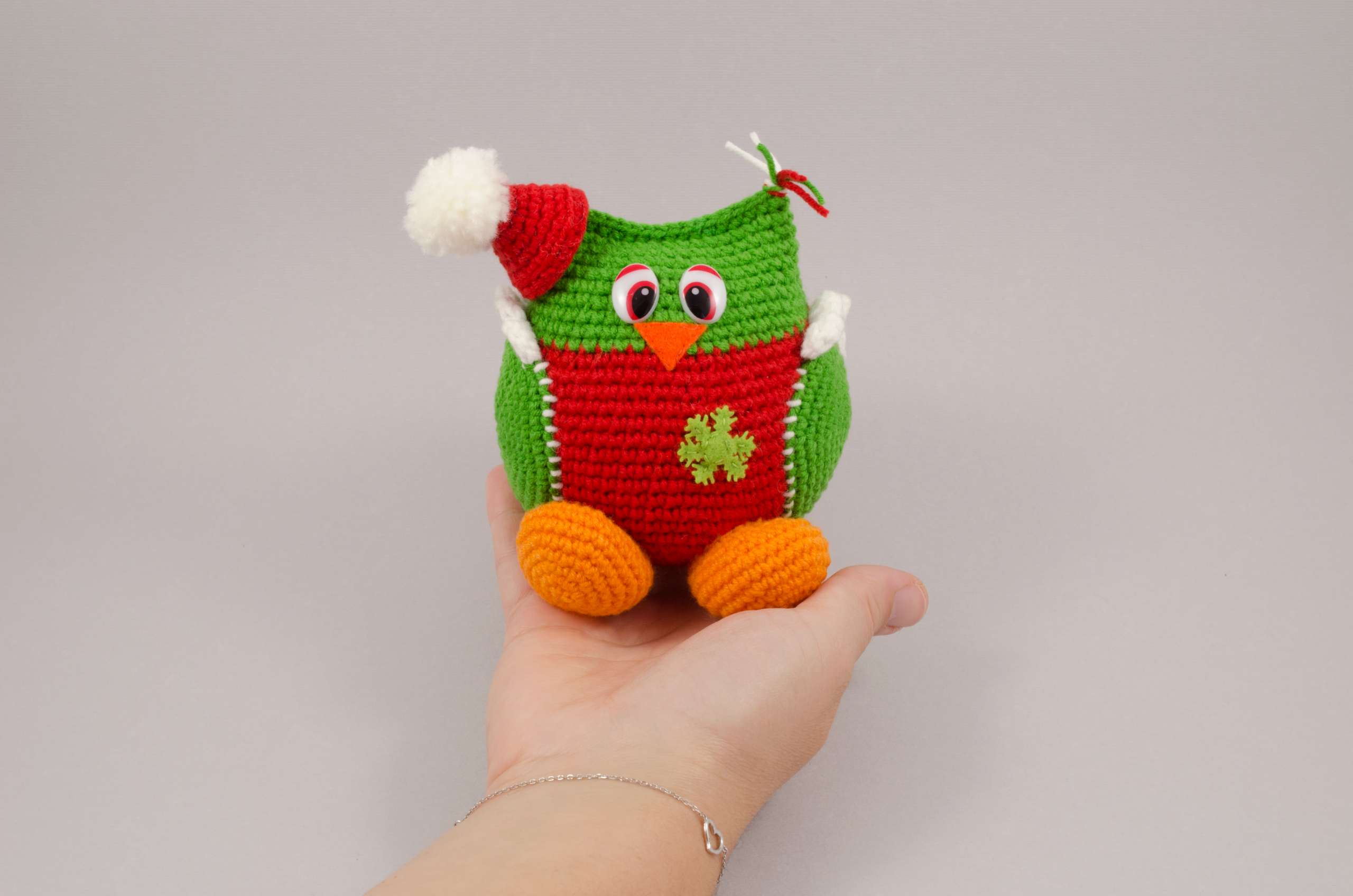 holding in hand amigurumi christmas owl