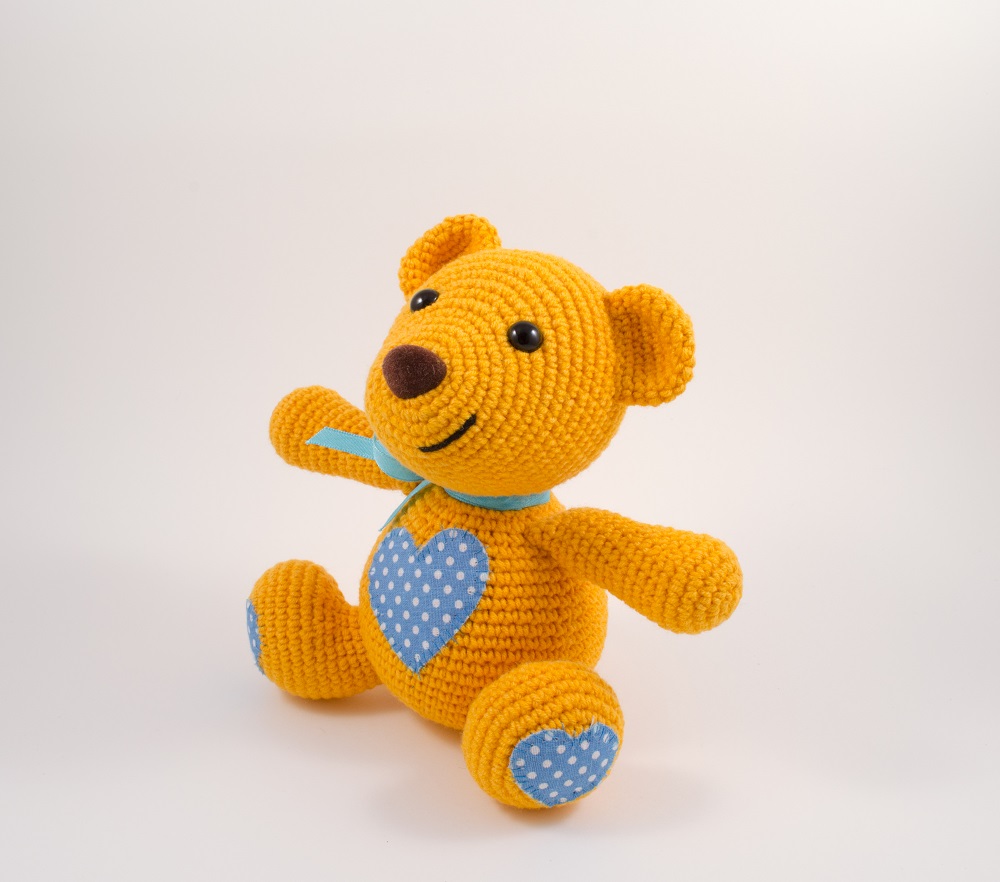 amigurumi orange teddy bear side view