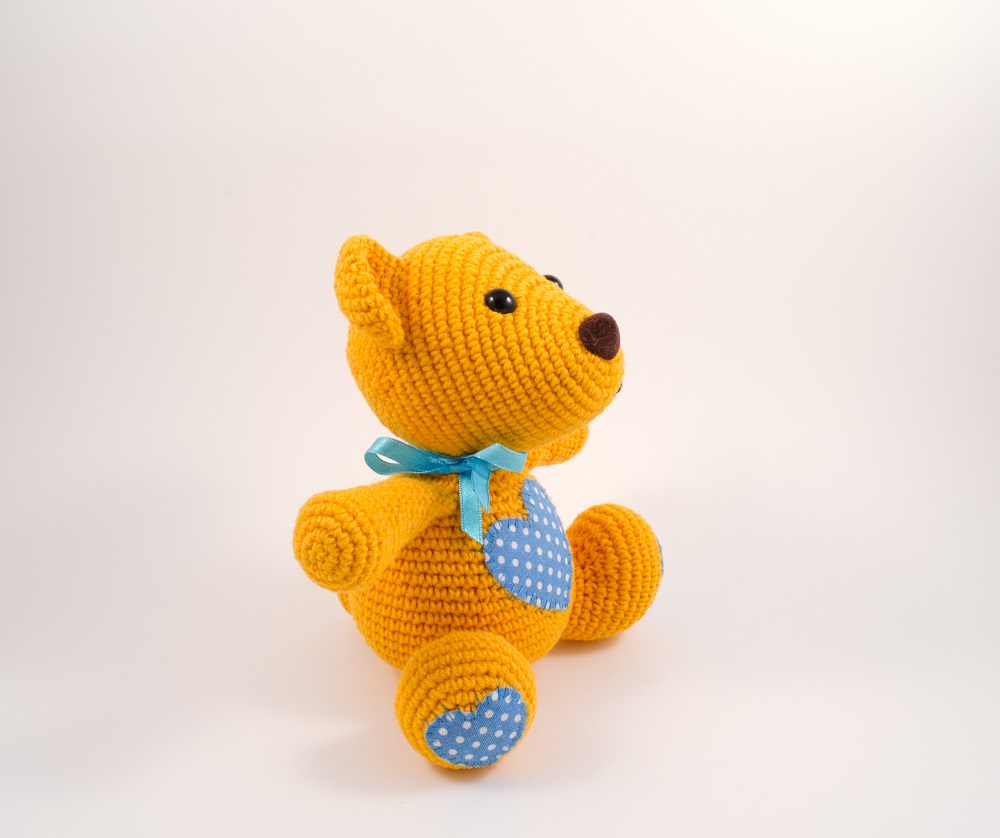 amigurumi orange teddy bear side view