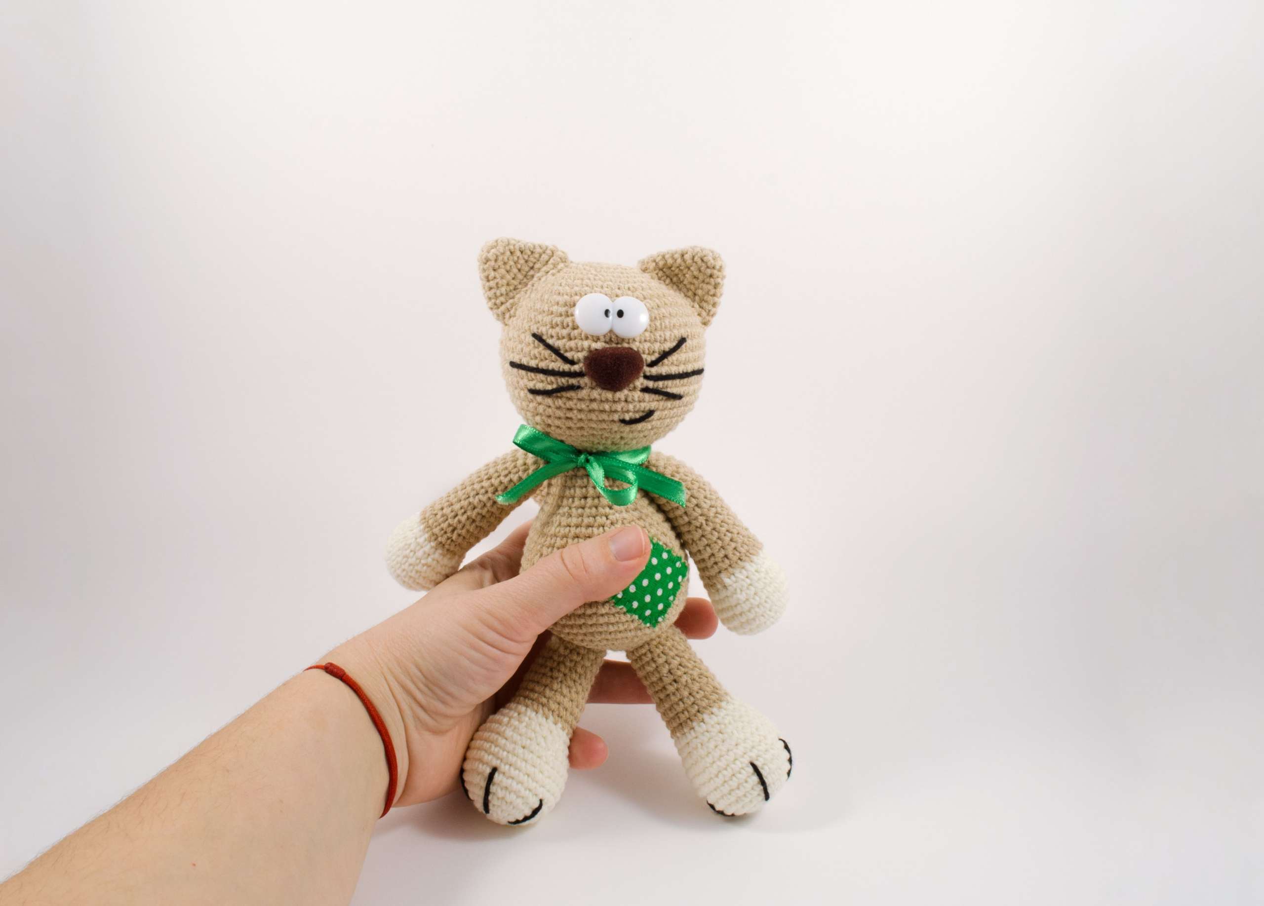 holding in my hand amigurumi cat