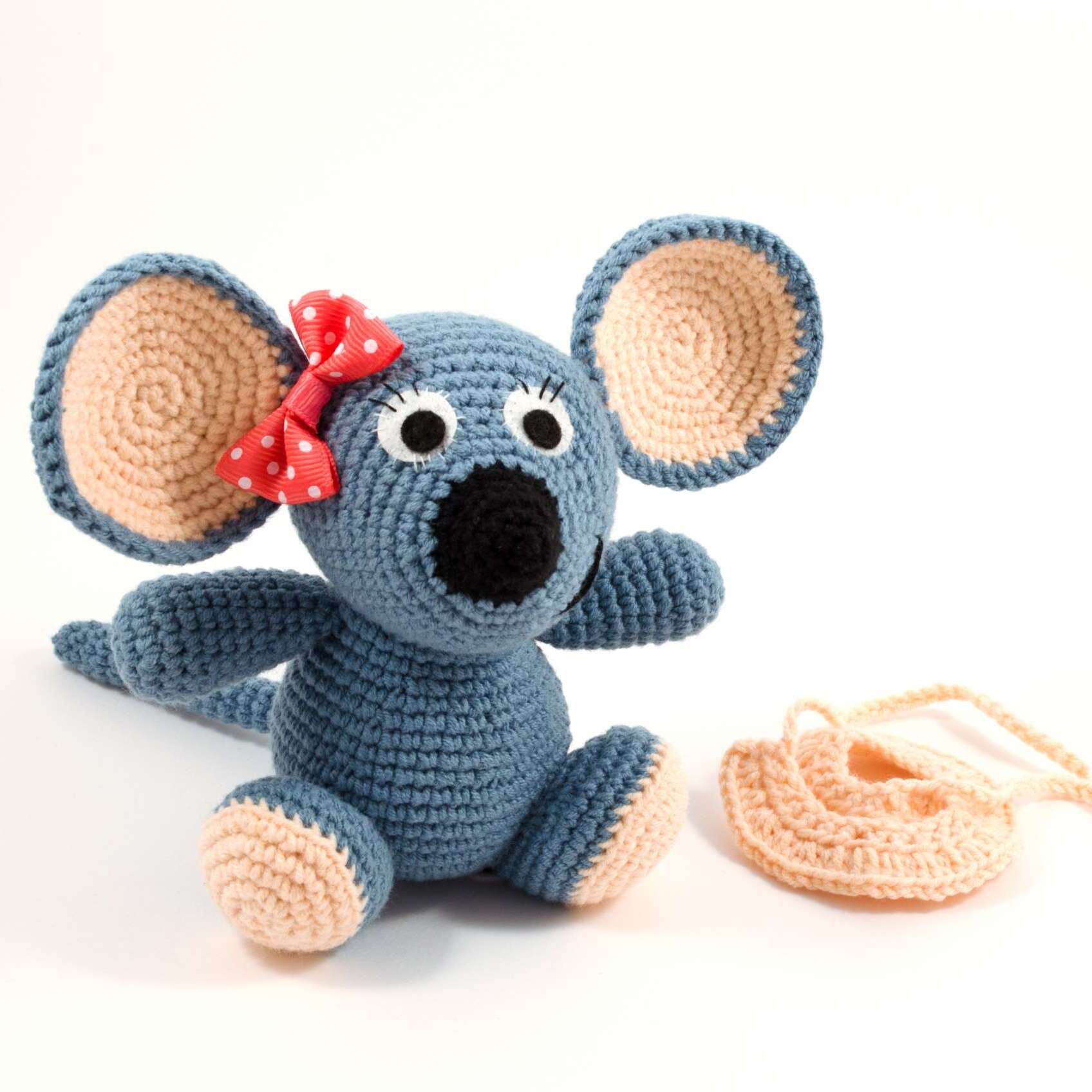 crochet mouse toy and pink skirt