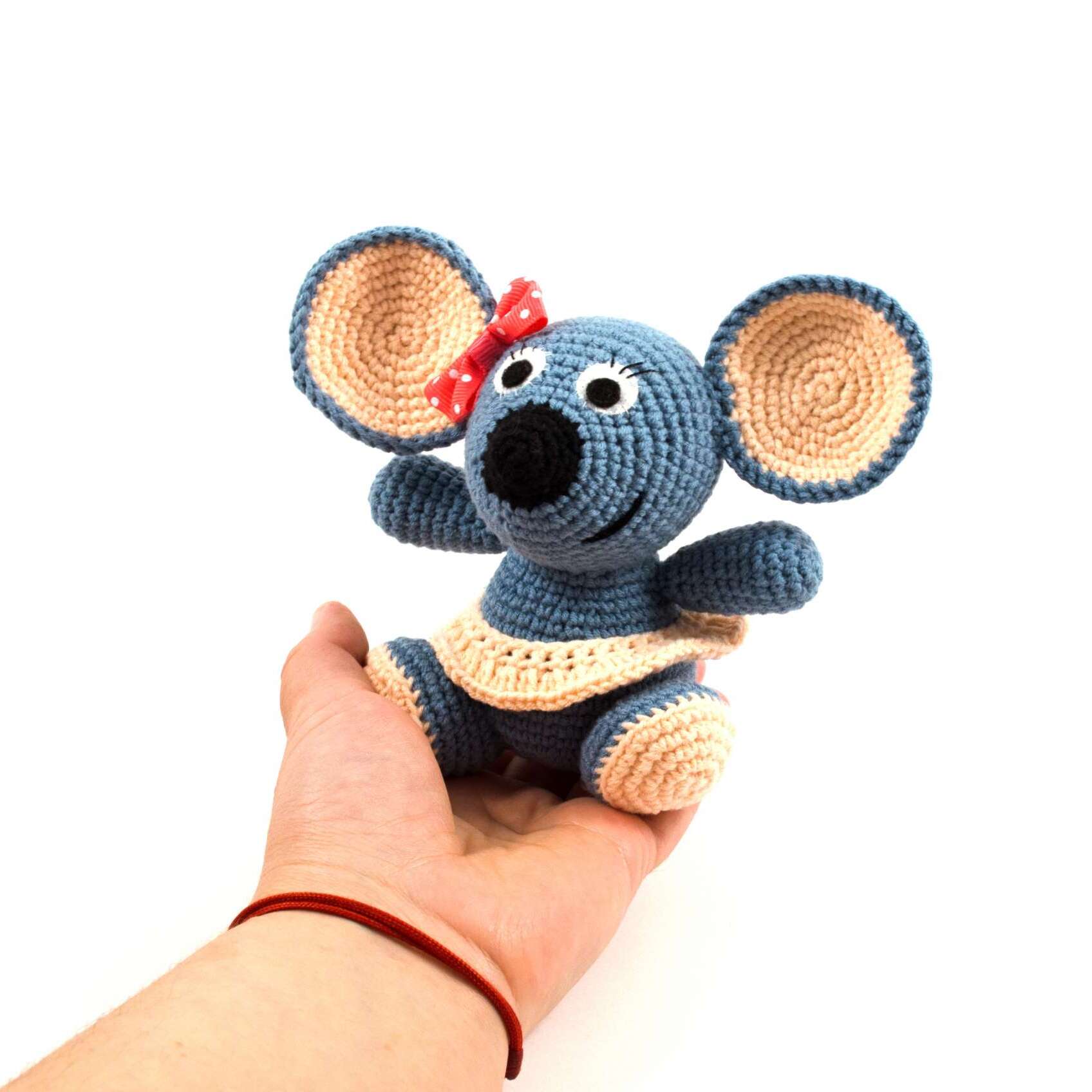 holding in hand crochet mouse toy