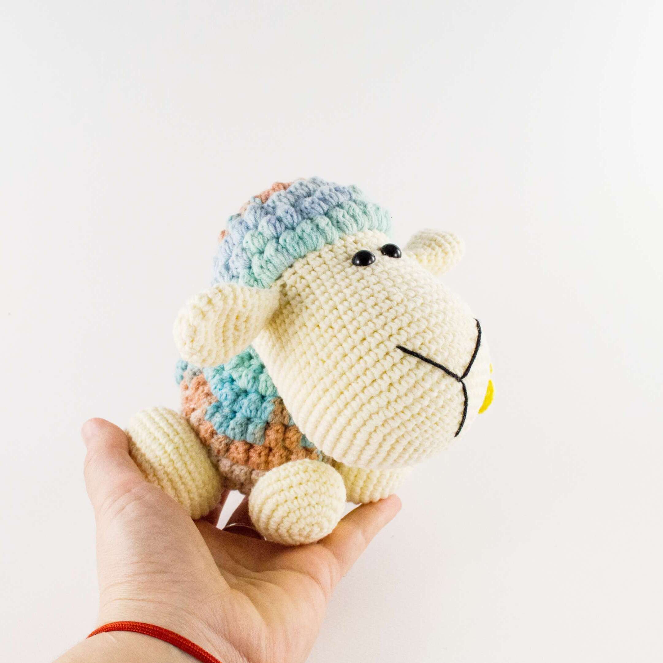 holding in hand crochet sheep
